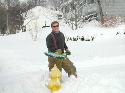 December 31, 2000 - Performing a usual post-snowstorm activity, Paul Turner shovels out a hydrant on Hartford Tpke. on the final day of the 20th Century!